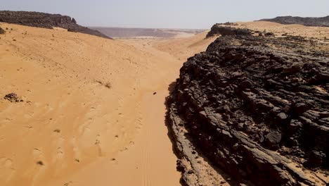 Atar-Mountain-Cliffs-near-Terjit-Oasis-in-Mauritania-Sahara-Desert,-Africa---Aerial-Drone-Flight