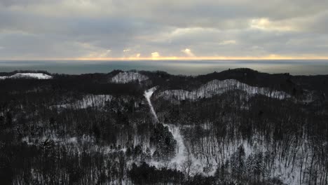 Winter-Woods-during-a-cloud-Sunset