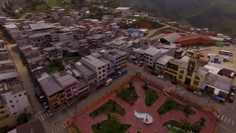 Ecuadorian-town's-city-center-with-misty-mountain-side-in-distance