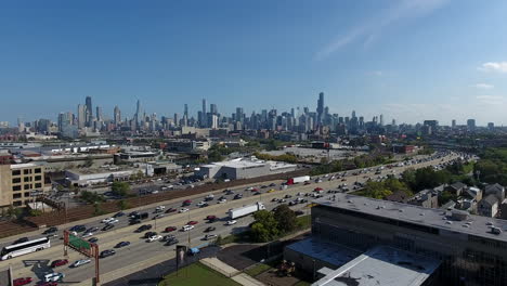 Chicago-IL-USA,-Aerial-View-of-Busy-Daily-Traffic-on-I-90-Highway-With-Downtown-Skyscrapers-in-Background