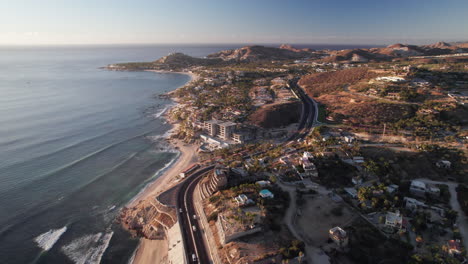 Aerial-establishing-shots-of-winding-road-through-Los-Cabos,-Mexico
