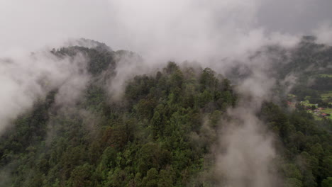 Aerial-flight-through-cloud-mist-over-mountains-in-Valle-De-Bravo-in-Mexico