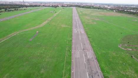 Wide-View-of-Flying-Over-Airport-Strip