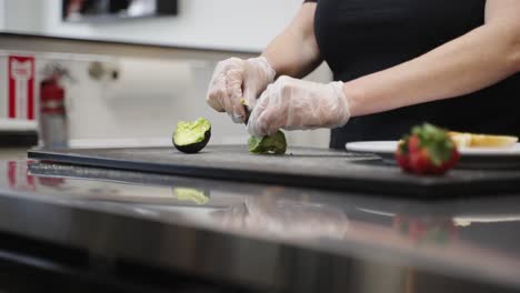 chef-preparing-avocado-toast-as-the-camera-pans-from-left-to-right
