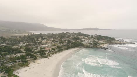 Carmel-By-The-Sea-Beach-Drone-Video-Foggy-Morning-Surfers-on-Waves---sliding-right
