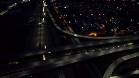 Night-aerial-view-of-highway-and-interchange-with-buildings-on-the-side---an-aerial-shot-of-Peshawar-morr-interchange-Islamabad---Night-aerial-view-of-Islamabad-Pakistan
