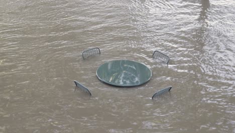 Heavy-Flood-from-River-Submerging-Outdoor-Table-and-Chairs---From-original-angle