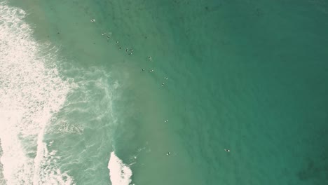 Carmel-By-The-Sea-Beach-Drone-Video-Foggy-Morning-Surfers-on-Waves---Circling-down-on-surfers