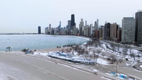 Aerial-view-around-the-Castaways-bar-at-the-North-Avenue-Beach,-winter-in-Chicago,-USA