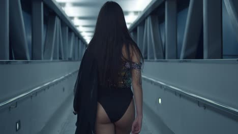 Amazing-latina-walks-in-an-overpass-at-night-in-a-sparkle-dress-before-turning-around-in-a-bikini-bottom