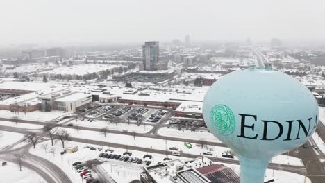 Aerial,-Edina-water-tower,-downtown-Edina-Minnesota-during-winter-season