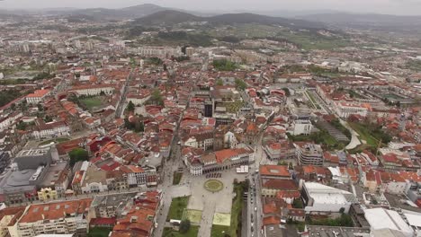 Flying-Over-From-Historic-City-Center-Buildings-in-Braga,-Portugal