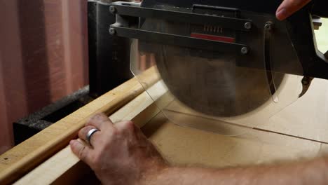 Slow-Motion-Close-Up-of-Wood-being-cut-by-table-saw-in-4k