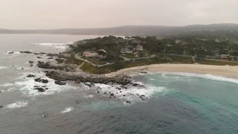 Carmel-By-The-Sea-Beach-Drone-Video-Foggy-Morning-Surfers-on-Waves---Circling-land