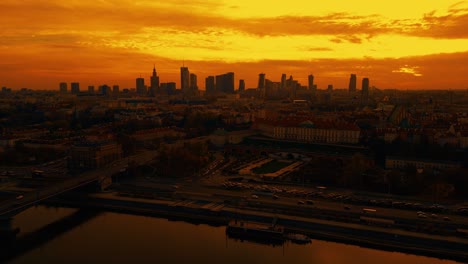 Beautiful-panoramic-aerial-drone-skyline-sunset-view-of-the-Warsaw-City-Centre-with-skyscrapers-of-the-Warsaw-City-and-Warsaw's-old-town-with-a-market-square-and-a-mermaid-statue,-Poland,-EU