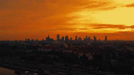 Beautiful-panoramic-aerial-drone-skyline-sunset-view-of-the-Warsaw-City-Centre-with-skyscrapers-of-the-Warsaw-City-and-Warsaw's-old-town-with-a-market-square-and-a-mermaid-statue,-Poland,-EU