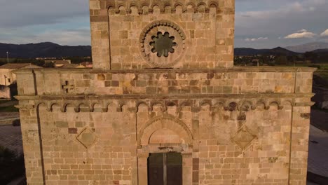 Beautiful-establisher-aerial-shot-of-Romanesque-Church-in-Tratalias,-Sardinia