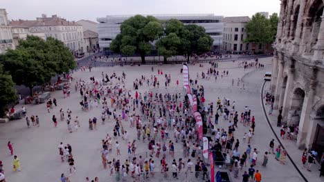 A-square-in-front-of-the-Roman-museum-and-the-arenas-of-Nimes-in-the-south-of-France,-queues-to-enter-the-arenas
