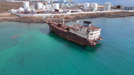 Lovely-aerial-view-flight-Liquified-Natural-Gas-LNG-fabric-Environmental-disaster
Shipwreck-on-beach-Lanzarote-Canary-Islands,-sunny-day-Spain-2023
