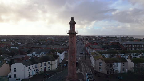 Inland-lighthouse-amongst-urban-setting-at-the-port-of-Fleetwood-with-tram-leaving
