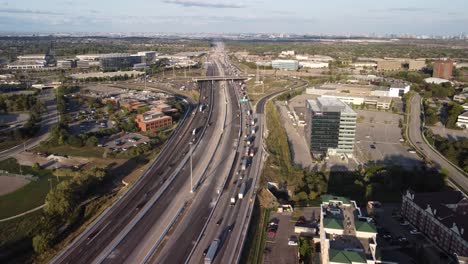 Drone-push-in-shot-of-a-busy-highway-3-lanes-1-way