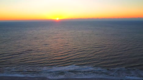 Early-Morning-Sunrise-Over-The-Ocean-And-Shore