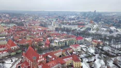 Aerial-shot-of-old-town-Vilnius,-Lithuania,-on-a-grey-winter-day