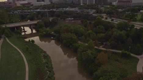 Aerial---Reveal-of-Houston-skyline-over-Bayou-Park-in-the-morning