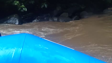 blue-rubber-boat-on-a-wild-river-in-the-tropics