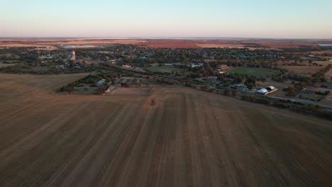 Aerial-towards-Small-country-town-Sea-Lake-sunrise,-Victoria-Australia