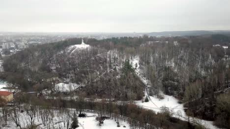 Aerial-shot-of-forest-hills-covered-in-snow