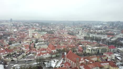 Aerial-shot-with-a-slow-tilt-above-the-old-town-of-Vilnius,-Lithuania