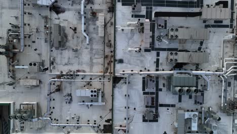 Top-down-aerial-descending-shot-of-HVAC-on-top-of-laboratory-in-America