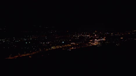 Night-timelapse-of-town-with-cars-driving-from-above