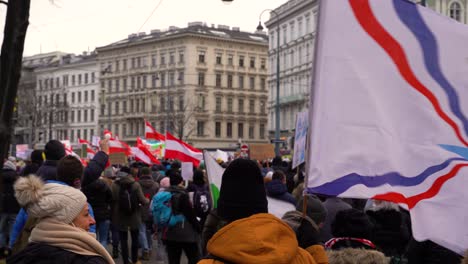 Many-nationalist-flags-waving-at-corona-protests-in-Vienna,-Austria
