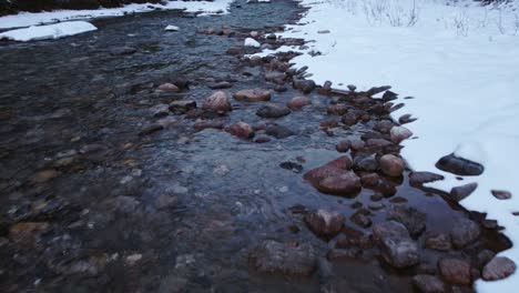 Creek-mountain-slow-reveal-in-winter-snow