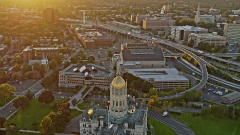 Hartford-Connecticut-Aerial-v14-birds-eye-view-of-state-capitol-building-and-traffics-on-transcontinental-highway-u