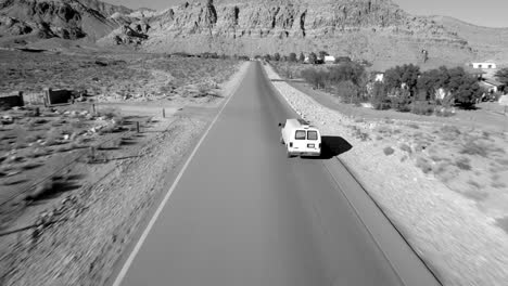 Aerial-tracking,-white-van-at-high-speed,-Red-Rock,-Las-Vegas-Nevada