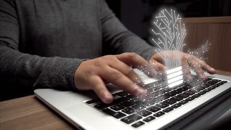 idea-concept.-hands-on-laptop-with-cybernetic-lightbulb