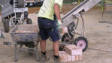 Construction-Worker-Stacks-Rows-Of-Bricks-At-New-Housing-Job-Site