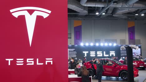The-American-electric-company-car-Tesla-Motors-logo-and-booth-during-the-International-Motor-Expo-showcasing-EV-electric-cars-in-Hong-Kong