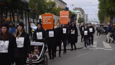 Demonstrators-Holding-Placards-And-Marching-On-The-Street-Of-Gothenburg-In-Swede
