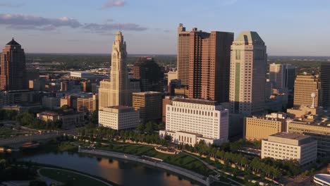 Aerial-view-around-downtown-Columbus,-golden-hour-in-Ohio---orbit,-drone-shot