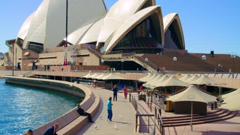 People-Hang-Out-At-Promenade-With-Cafe-Near-Sydney-Opera-House-In-NSW,-Australia