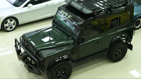 overview-of-land-rover-defender-classic-moss-green-color-110,-british-safari-car-vintage-1990