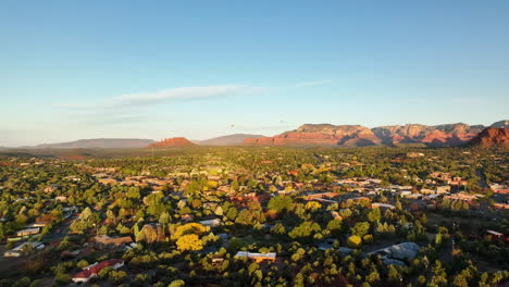 Cinematic-slow-rotating-drone-shot-of-mountains-and-houses-in-Sedona-Arizona