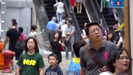 Asian-people-extremely-slow-motion-footage-inside-a-shopping-mall-with-crowd-using-escalators