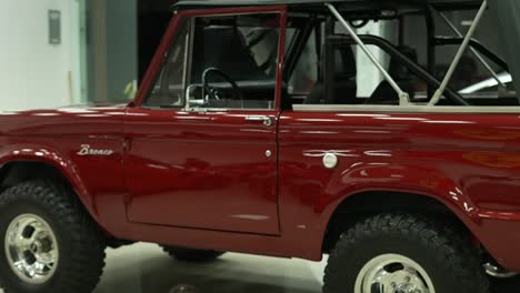 front-end-and-roof-of-classic-ford-bronco-vintage-red,-old-pick-up-vehicle
