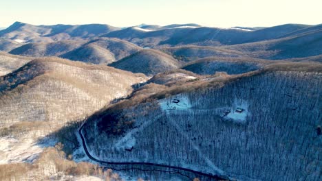 aerial-winter-tilt-down-mountain-range-in-watauga-county-nc,-north-carolina