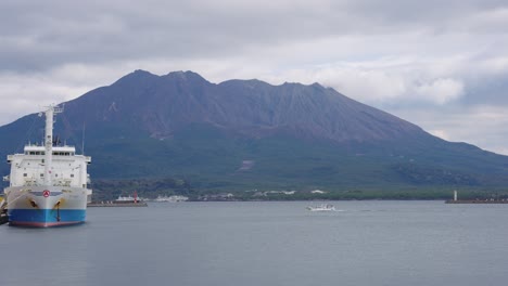 Kagoshima-Bay-and-Harbor,-Ships-and-Sakura-jima-Volcano-in-the-Background,-Japan
